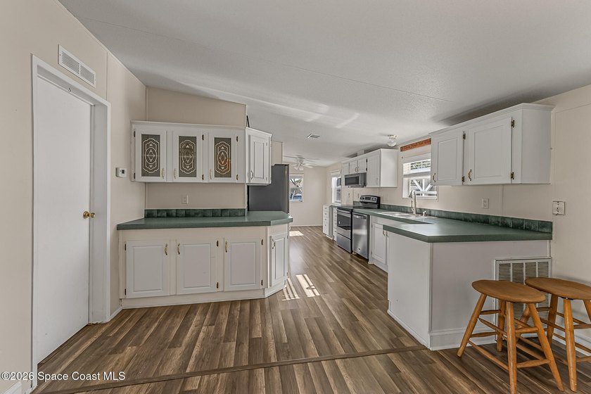 Enjoy this charming 3-bed, 2-bath home in Palm Bay Estates, a - photo 7