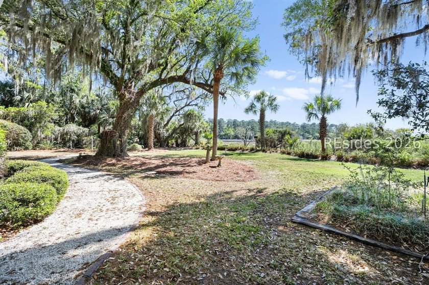 Set against a breathtaking Lowcountry backdrop, this stately - photo 49