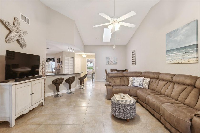 This beautifully updated villa-style home features an open - photo 2