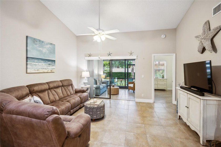 This beautifully updated villa-style home features an open - photo 3