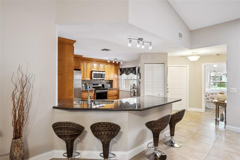 This beautifully updated villa-style home features an open - photo 4