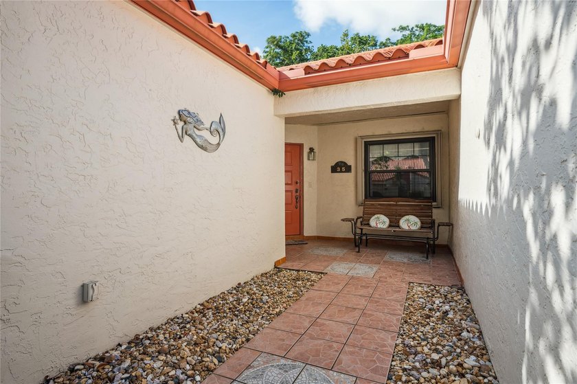 This beautifully updated villa-style home features an open - photo 8