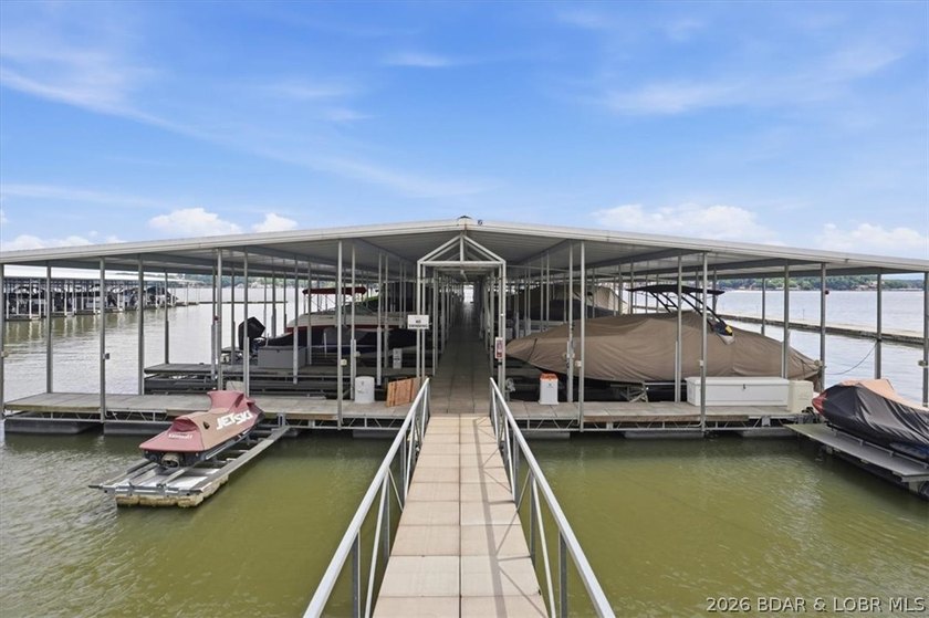 36 Foot Boat Slip with Polylift Hoist, a PWC Slip and a fully - photo 34