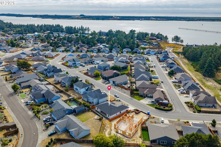 Experience modern coastal living in this custom-built 2023 home - photo 11