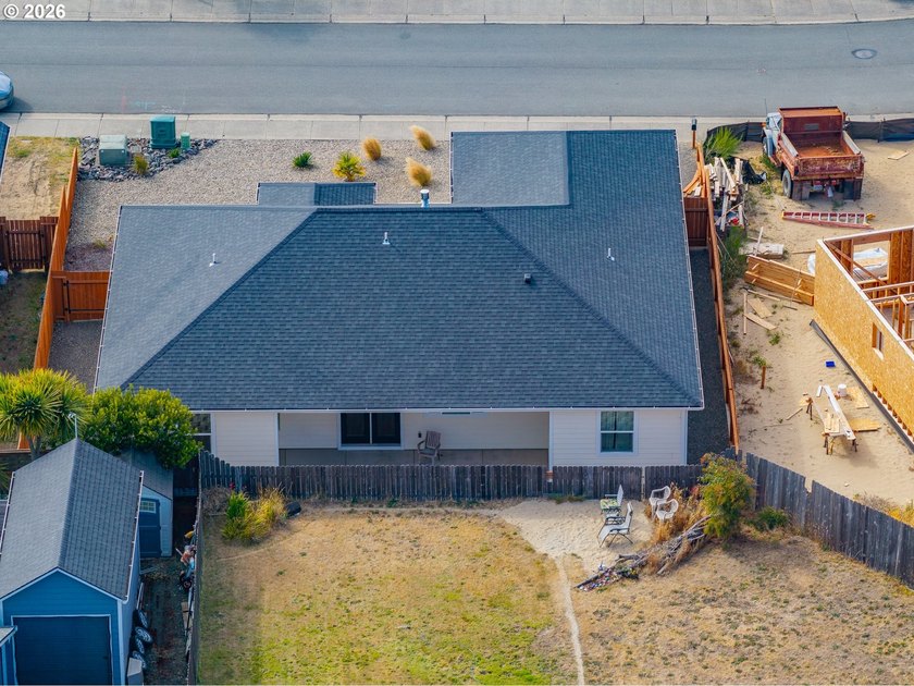 Experience modern coastal living in this custom-built 2023 home - photo 13