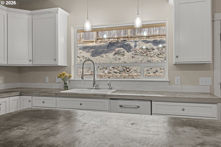 Experience modern coastal living in this custom-built 2023 home - photo 25
