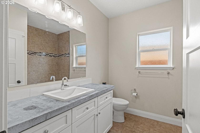 Experience modern coastal living in this custom-built 2023 home - photo 34