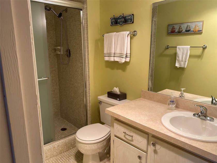 WATER VIEW ! FROM THIS 2ND FLOOR, MOVE IN READY UNIT. FULLY - photo 15