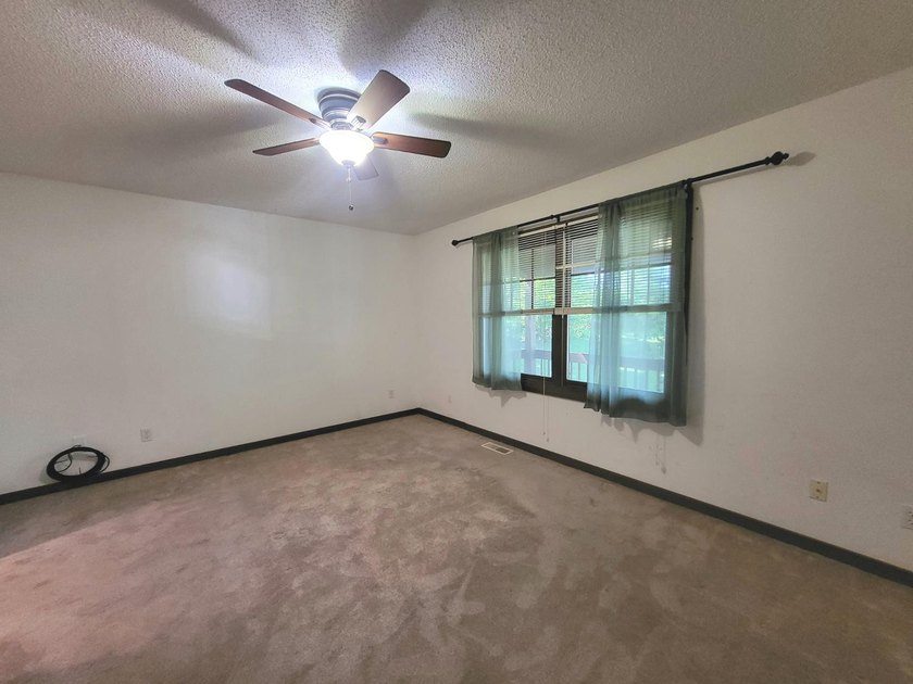 Cabin vibes, wooded views, extra lot, under $300,000.00. Located - photo 11