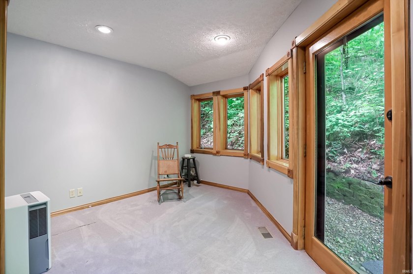 Set on nearly 6 wooded acres, this contemporary custom home - photo 15