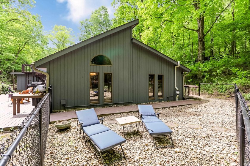 Set on nearly 6 wooded acres, this contemporary custom home - photo 35