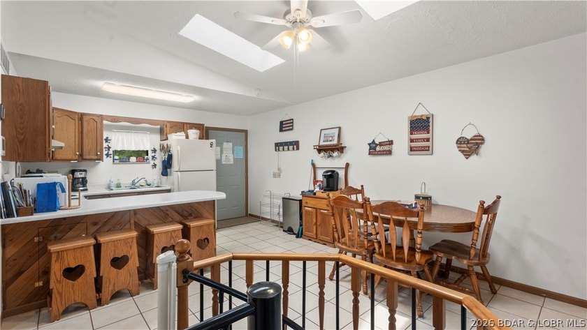 Discover peaceful lakefront living in this charming home tucked - photo 11