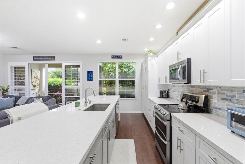 Beautifully updated newer-construction townhome in the - photo 13