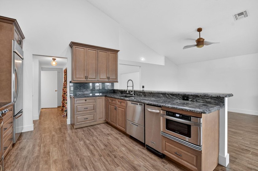 Welcome to this beautifully updated home located in the highly - photo 11