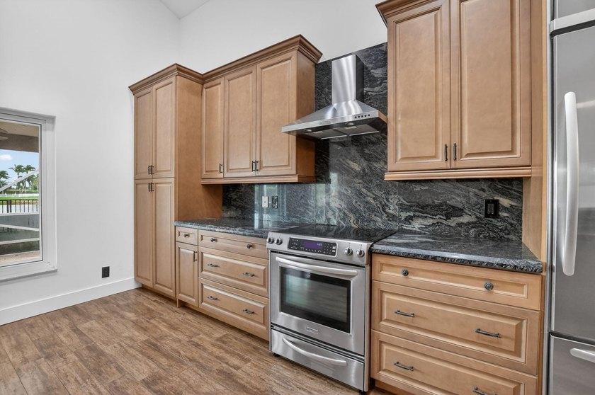 Welcome to this beautifully updated home located in the highly - photo 13