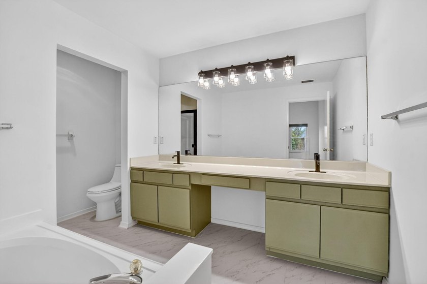 Welcome to this beautifully updated home located in the highly - photo 16
