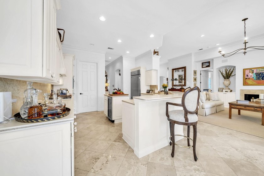 Welcome to luxury, low-maintenance living in the prestigious - photo 27