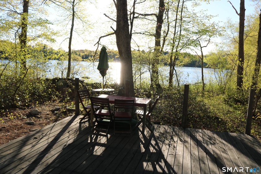 Enjoy the serenity of an *on golden pond* setting with this - photo 6