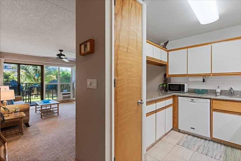 Aloha and welcome to Kihei Akahi C-317! This hotel-zoned - photo 12