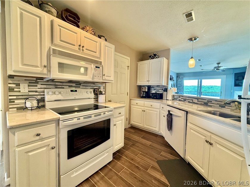 Experience lake life at its finest in this stunning condo - photo 11