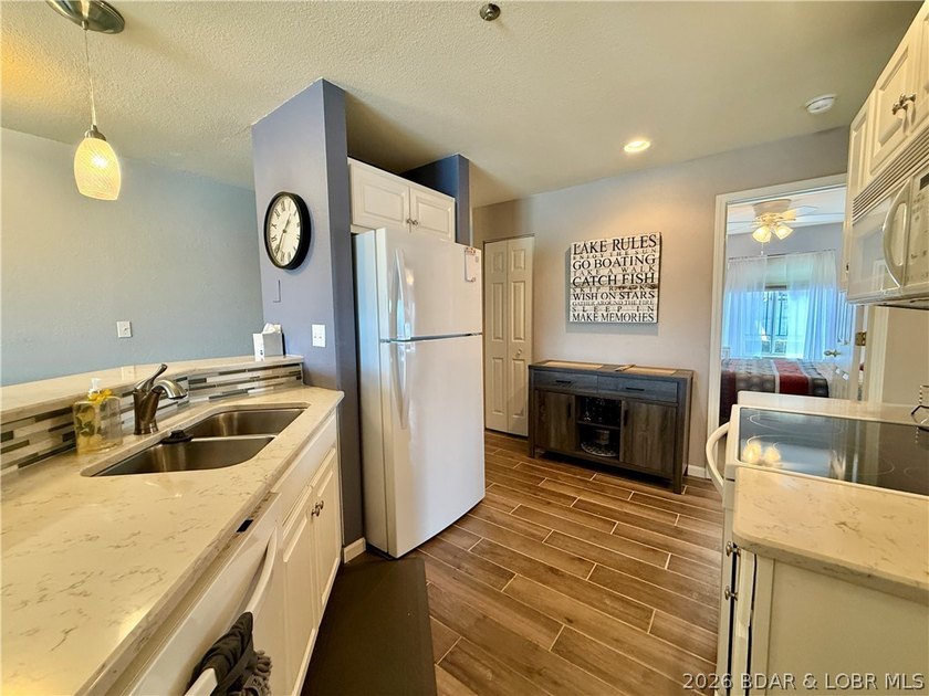 Experience lake life at its finest in this stunning condo - photo 13