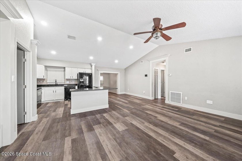 Welcome to a home where comfort meets style. This updated - photo 4