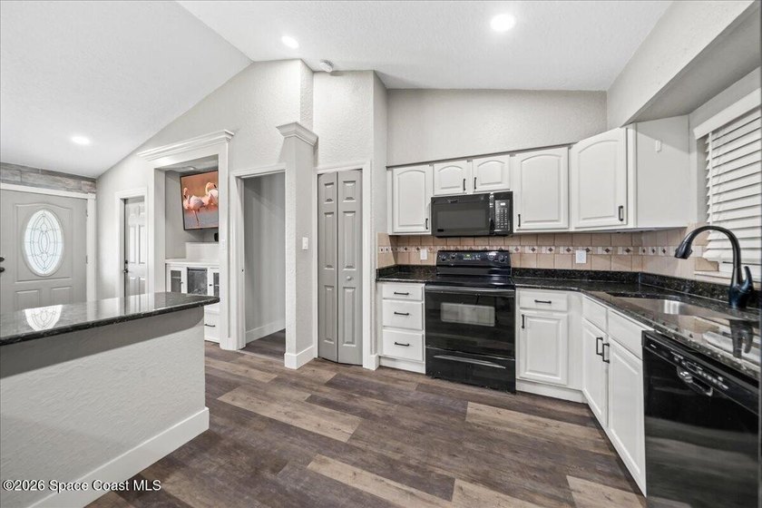 Welcome to a home where comfort meets style. This updated - photo 6