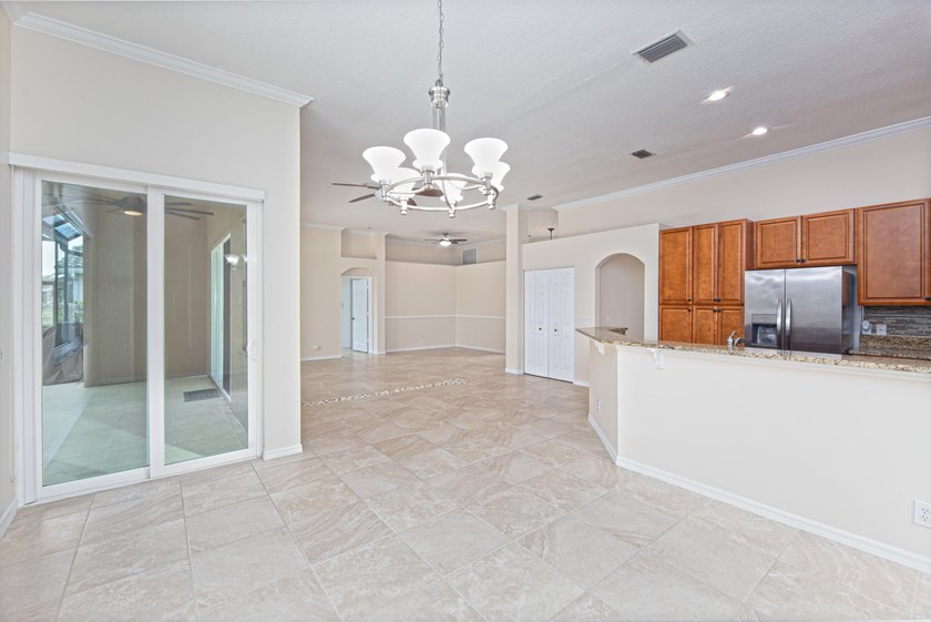 Beautifully remodeled 3BR/2BA heated saltwater pool home in - photo 11