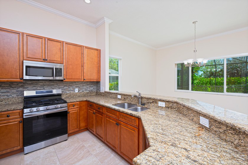 Beautifully remodeled 3BR/2BA heated saltwater pool home in - photo 14