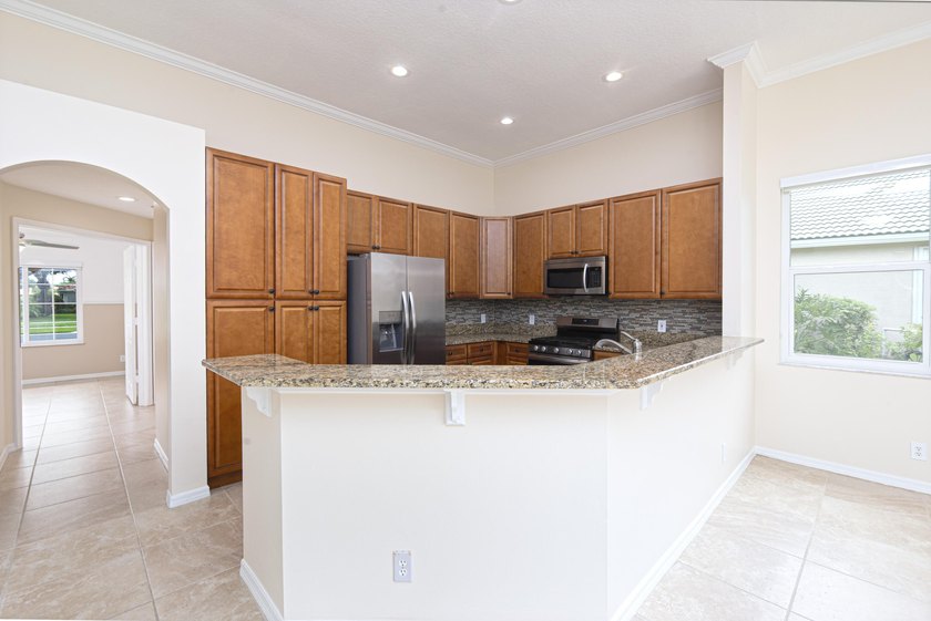 Beautifully remodeled 3BR/2BA heated saltwater pool home in - photo 15