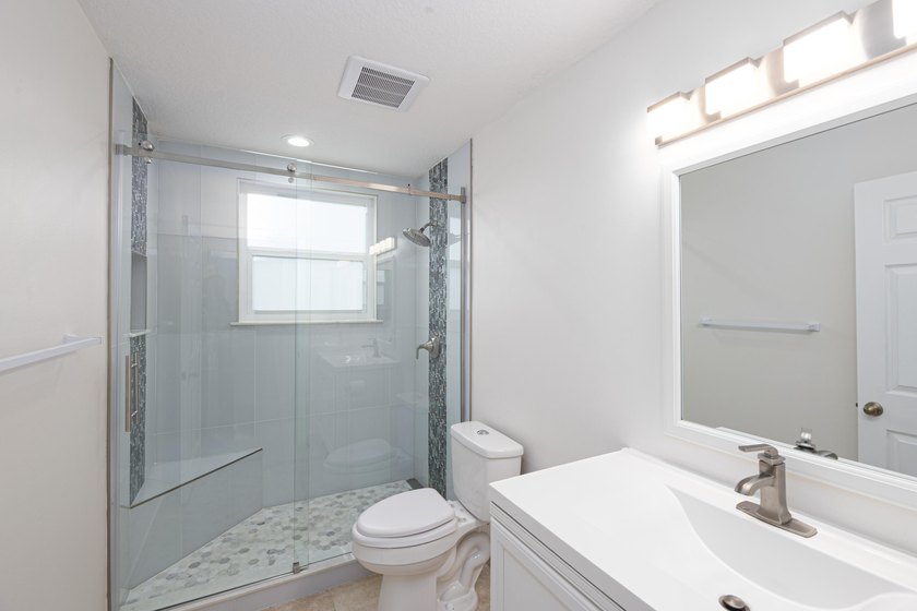 Beautifully remodeled 3BR/2BA heated saltwater pool home in - photo 18