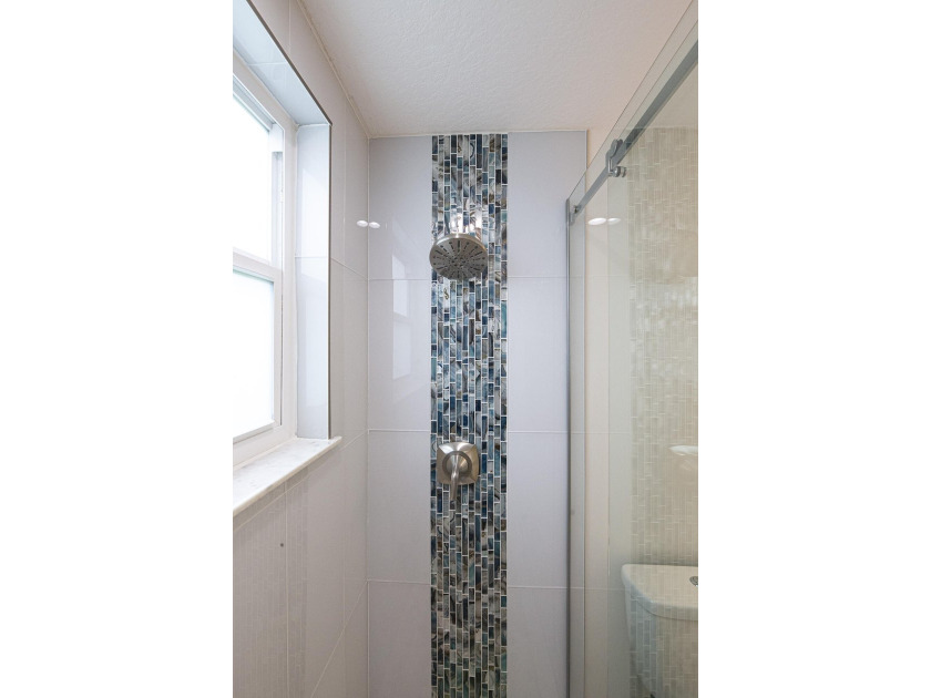 Beautifully remodeled 3BR/2BA heated saltwater pool home in - photo 19