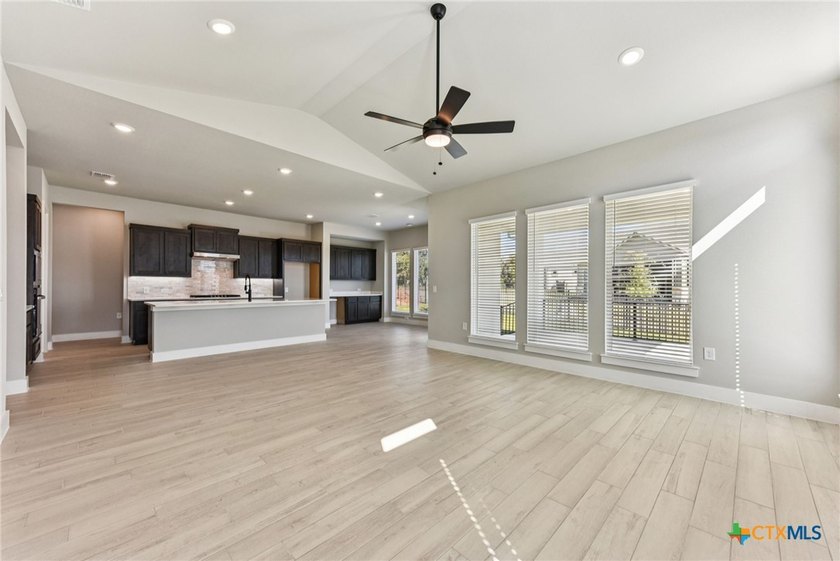 Auburn Plan with upgraded kitchen, quartz countertops, dry bar - photo 8