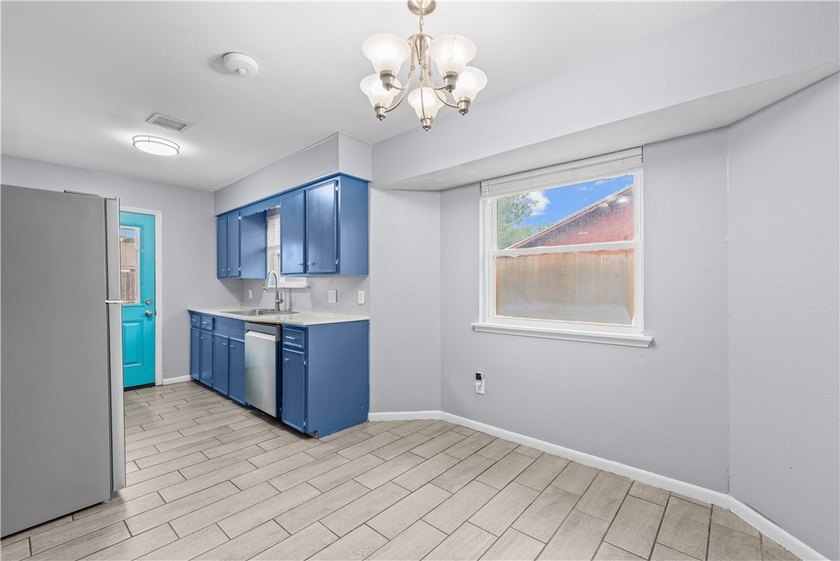 Welcome home to this beautifully remodeled 5-bedroom, 2 full - photo 6