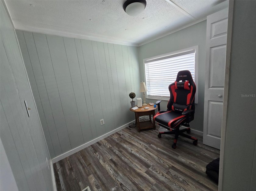 This manufactured home sits on owned land in The Villages. No - photo 11