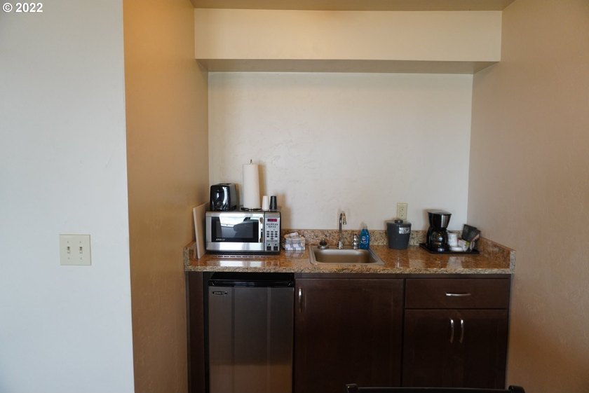 Oceanfront living at its best! A rare TOP floor unit ensures a - photo 11