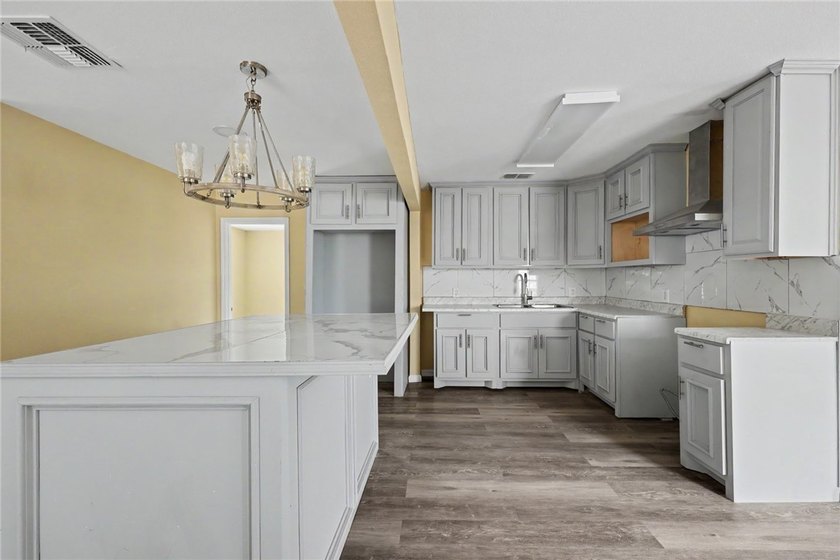 Totally remodeled 3-bedroom,2-bathroom home located in the - photo 3