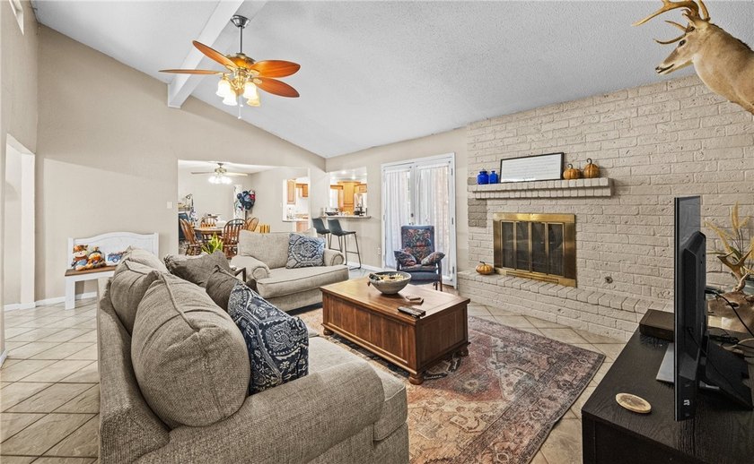 This 3-bed, 2-bath brick home sits on a large corner lot in an - photo 5