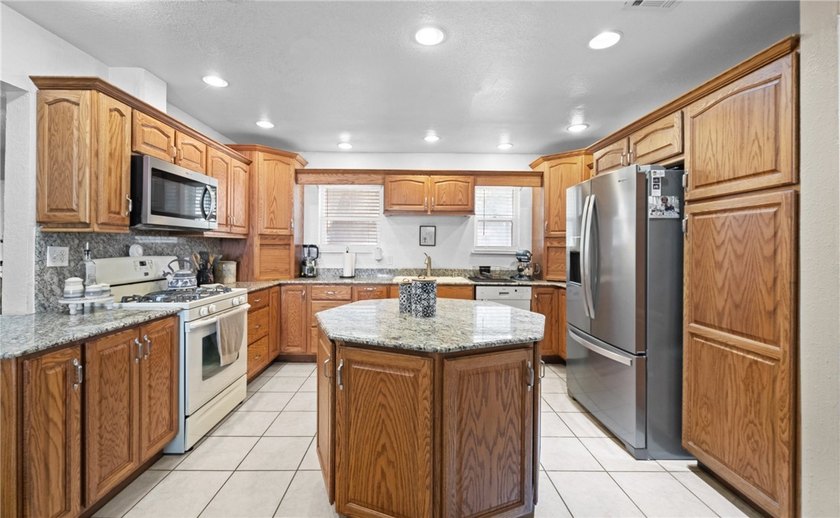 This 3-bed, 2-bath brick home sits on a large corner lot in an - photo 8