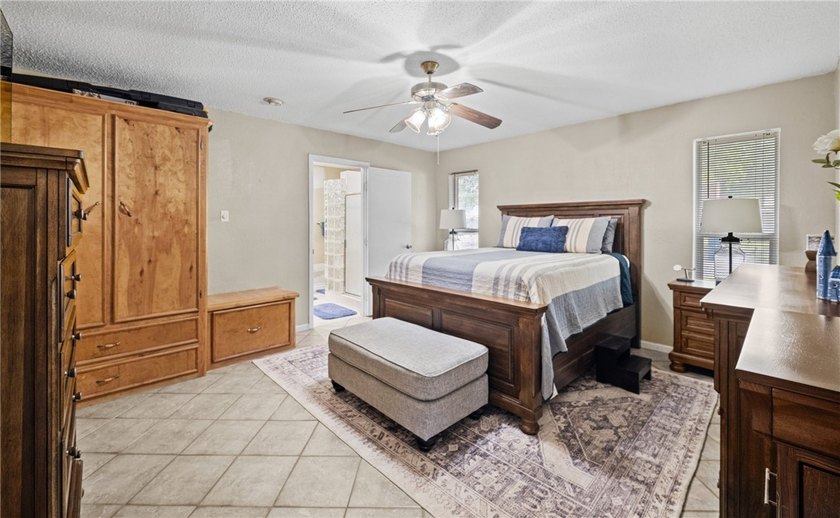 This 3-bed, 2-bath brick home sits on a large corner lot in an - photo 10