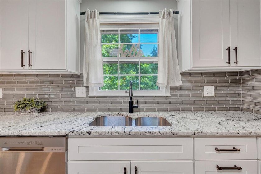 Welcome to this beautifully updated ranch home located in the - photo 28
