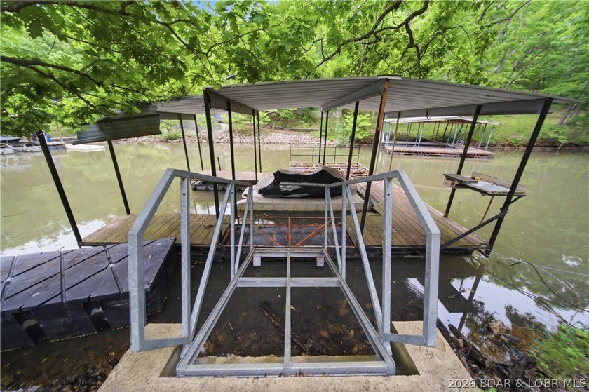 Tucked away in a peaceful cove in Sunrise Beach, this - photo 34