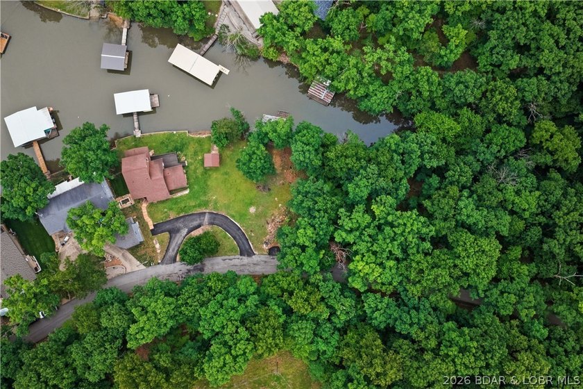 Tucked away in a peaceful cove in Sunrise Beach, this - photo 48