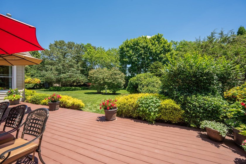 Tucked behind lush, mature landscaping, 52 Seagate is a verdant - photo 31