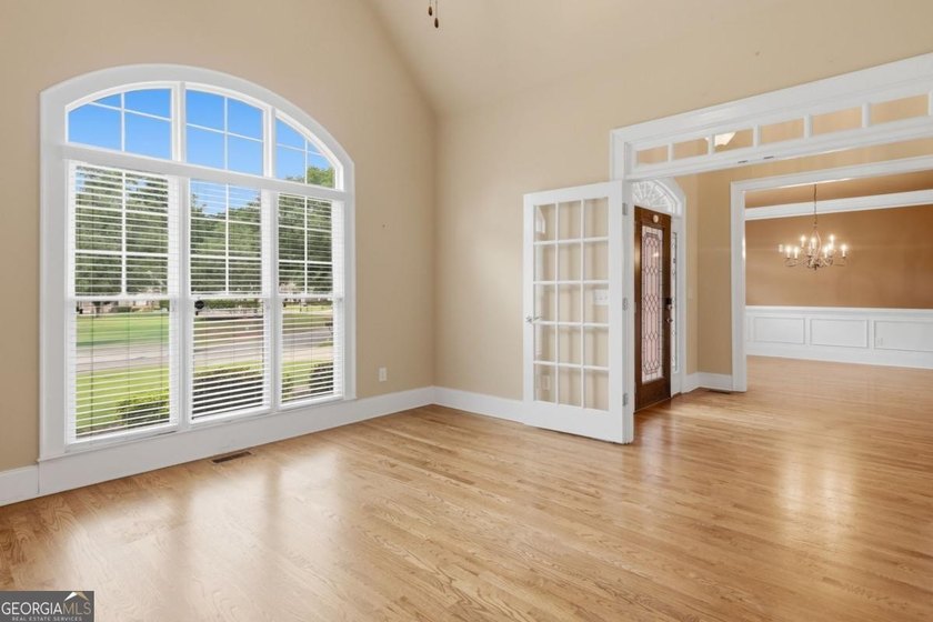 You will love this 6-bedroom home with the primary suite on the - photo 9