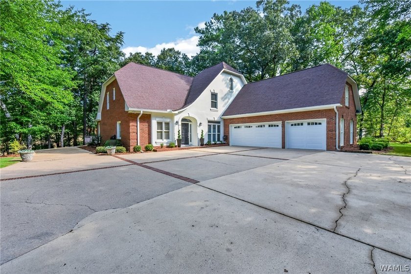 Nestled on a wooded golf course lot in the sought-after - photo 3