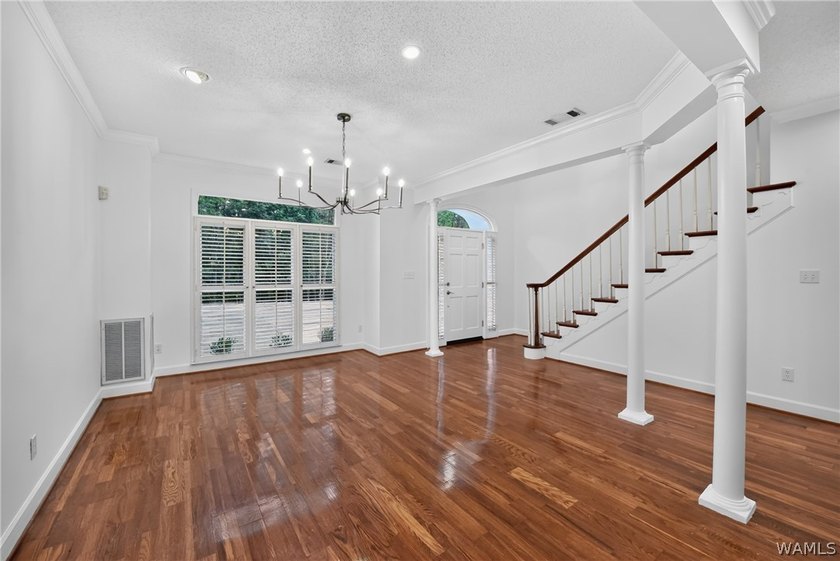 Nestled on a wooded golf course lot in the sought-after - photo 8