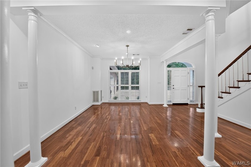 Nestled on a wooded golf course lot in the sought-after - photo 9