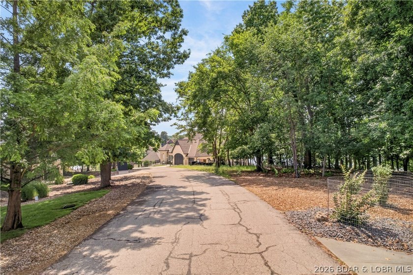 Discover the perfect setting for your dream lakefront estate in - photo 11