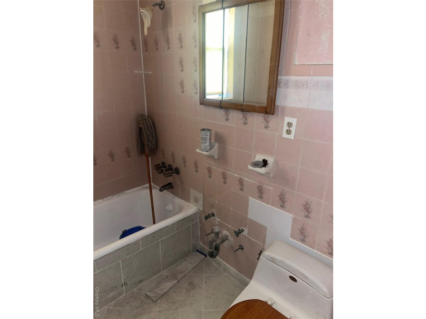 Welcome to this solid brick 4-family attached home located in - photo 12